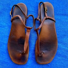 These Have Been Loved And Used, But Have A Lot Of Life Left In Them. Super Soft Brown Leather Flat Heel Thong Design. Perfect For Your Next Trip To Europe. These Pre-Loved Sandals Are In Fair Condition With Obvious Signs Of Wear And Come In A Size 40 (Fits Me As A Size 9). 100%Authentic. Sold As Is. Flat Leather Sandals, Brown Leather Flats, Trip To Europe, Leather Sandals Flat, Saint Laurent Shoes, Soft Brown, Europe Travel, Women's Shoes Sandals, Leather Sandals