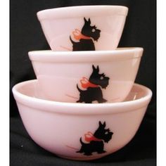 four white bowls with scottie dogs on them