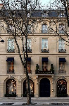 the building has many windows and balconies on it