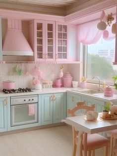 a pink and blue kitchen with lots of counter space, cabinets, and decor on the walls