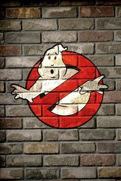 a brick wall with a sign on it that says no ghosties in red and white