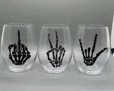 three wine glasses with hand prints on them