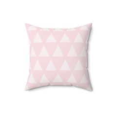 a pink pillow with white triangles on the front and back, sitting on a white background