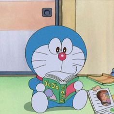 a cartoon character sitting on the floor reading a book