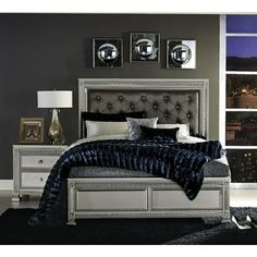 Product Description:- Modern glamour is exemplified in the design of this Collection. Acrylic crystals frame the California King bed and nightstand, reflecting the light to create eye-catching drama. The silver finish serves as the perfect complement to the high-polish decorative knob hardware and medallion accents. Providing contrast to finish is the dark gray faux leather, button-tufted headboard panel. Product Dimensions:- California King Size Bed : 80.75"W X 91.75"L X 59.75"H 2 x Nightstands Silver Nightstand, Silver Vanity, Button Tufted Headboard, Hampton House, Glam Bedroom, Tufted Bed, Upholstered Panel Bed, Bedroom Panel, Queen Bedroom