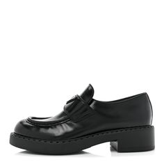 This is an authentic pair of PRADA Spazzolato Metal Triangle Logo 50mm Loafers size 38.5 in Black. These stylish loafers are crafted of black leather with black stitching, a silver Prada emblem, and rubber soles. Triangle Logo, Prada, Dust Bag, Black Leather, Loafers, Stitching, ? Logo, Heels, Silver