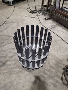 a large metal object sitting on top of a cement floor