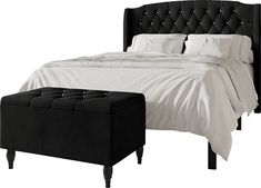 a black bed with white sheets and a footstool on the end table next to it