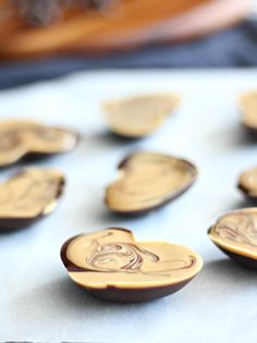 some brown and white buttons sitting on top of a table