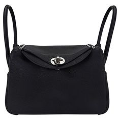 Mightychic offers an Hermes Lindy 26 bag featured in Black. Plush Clemence leather. Crisp with Palladium hardware. Functional as a top handle bag or a hands free shoulder bag. Exterior pocket on each side and surprisingly spacious interior. Top has two zippers for easy closure. The Clemence leather is soft and pliable, adding so much to the styling of the bag. Comes with signature Hermes box and sleeper. NEW or NEVER WORN. final sale BAG MEASURES: LENGTH 26 cm / 10.25" TALL 17.25 cm / 6.25" DEEP