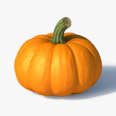 an orange pumpkin sitting on top of a white surface