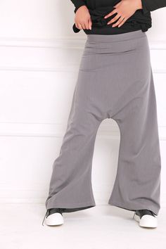 Women Harem Pants, Gray Pants, Drop Crotch Pants Drop crotch sweatpants in wide leg: |KONGO| GARMENT FEATURES: * Clean, minimalistic design * Very low drop crotch silhouette * Wide leg fit * Elasticated * Practical, in-seam side pockets * Made from quality soft sweatshirt jersey COLOUR OPTIONS: This product is available in the following colour options: - black; - ecru; - graphite grey; - light grey; - royal blue. SIZE & FIT: Model is 175cm tall and wears size S. COMPOSITION: Main: 100% cotto Baggy Yoga Trousers For Spring, Casual Baggy Wide Leg Yoga Pants, Casual Baggy Wide-leg Yoga Pants, Baggy Solid Yoga Pants For Spring, Casual Baggy Yoga Trousers, Baggy Solid Color Cargo Pants, Baggy Solid Cargo Pants, Stretch High-waisted Cotton Harem Pants, Stretch Cotton High-waisted Harem Pants