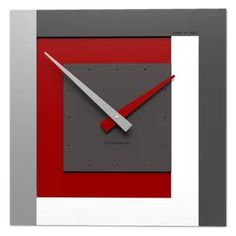 a square clock with a red and grey design on it's face is shown