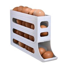 an egg tray with six eggs in it on a white background and the bottom half is open