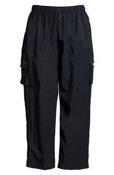 Cargo pockets and a relaxed fit give your off-duty look a utilitarian finishing touch in woven sweatpants finished with an adjustable drawcord waist. 29 1/2" inseam; 19" leg opening; 12 1/2" front rise; 17" back rise (size Medium) 100% nylon Machine wash, tumble dry Imported Off Duty, Nike Sportswear, Cargo Pants, Sweatpants, Nordstrom, Relaxed Fit, Black White, Size Medium, Nike