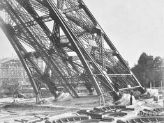 black and white photograph of the eiffel tower in paris, france during construction