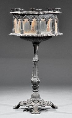 an ornate metal candle holder with candles on it