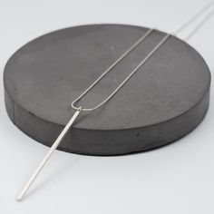 This minimalist  style pendant is made of 2mm thick square profile silver wire and etched on surface. You can easily combine these simple necklaces with other pieces or wear it on its own. We made the pendant in silver or half-coated in dark grey Rhodium finish.  The necklace is made in sterling silver and it closes with simple spring-ring clasp, whereas the pendant is handmade 95% silver sheet, etched on surface to create beautiful texture, typical of Thai Karen silver products.  Size: pendant Simple Necklaces, Bar Pendant Necklace, Silver Bar Necklace, Bar Pendant, Silver Bars, Simple Necklace, Silver Pendant Necklace, Bar Necklace, Minimalist Style