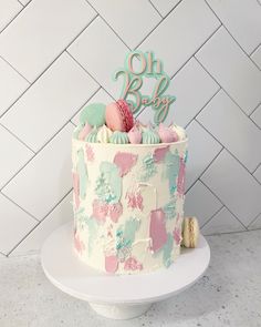 there is a cake that has been decorated with pastel colors