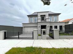 a large house with a gate in front of it