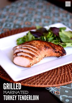 grilled marinated turkey tender pork on a plate with lettuce and salad