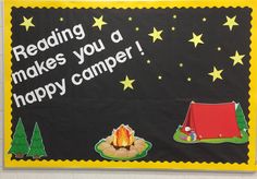 a bulletin board that says reading makes you a happy camper