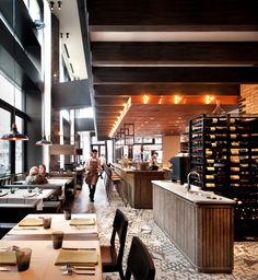 the restaurant is empty and ready for customers to eat their meal in it's large dining area