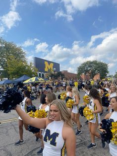 a group of cheerleaders walking down the street