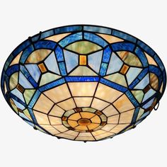 a stained glass ceiling light with blue and yellow colors on the top, against a white background