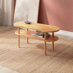 a wooden table sitting on top of a rug