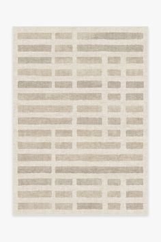 a beige and grey rug with horizontal lines on the bottom, in an abstract manner