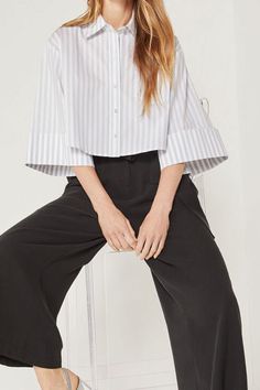 A professional stripe print adorns this unconventional cropped shirt! Runs big, please size down Spread collar 3/4 wide sleeves Front button closure Cropped hem Stripe print Material: 73% cotton, 23% polyester, 4% elastane Care: Machine wash cold. Do not bleach. Tumble dry low. Imported Shipping times: 2-5 business days Kick Flare Jeans, Cropped Shirt, Destroyed Jeans, Stripe Shirt, Plus Size Shopping, Wide Sleeves, Crop Shirt, Shirt Sale, Stripe Print