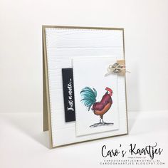 a card with a rooster on it and a tag hanging off the front of it