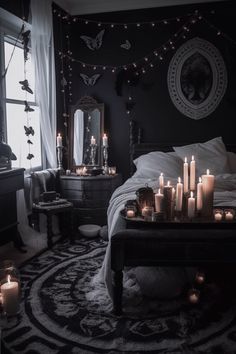 a bedroom with candles lit on the bed