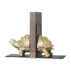 two bookends made out of wood and metal, each with a tortoise shell