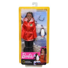 the barbie doll is wearing an orange jacket and black pants with a penguin on it