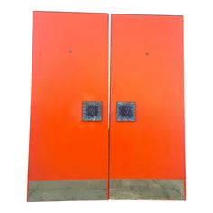 an orange door with two blue squares on it