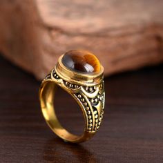 Tiger's Eye Ring, Gold Brass Ring, Tigers Eye, Genuine Gemstone, Delicate Ring, Statement Ring, Energy Jewelry, handmade Ring Material:- Brass Size:- Any ♥Brass, unlike gold, is a metal that can oxidize over time. To avoid and delay this oxidation, I recommend that you do not sleep with your jewels, and not expose them to water.                                                                                   The ring can be customized on request and the gemstone can be made to any gemstone you Vintage Jewelry With Natural Round Stones, Vintage Crystal Ring With Stone Setting As Gift, Spiritual Gemstone Rings For Jewelry Making, Handmade Adjustable Rings With Round Stone, Handmade Adjustable Ring With Round Stone, Vintage Adjustable Ring With Natural Stones, Handmade Spiritual Crystal Ring, Vintage Crystal Gemstone Open Ring, Vintage Rings With Natural Stones For Gift