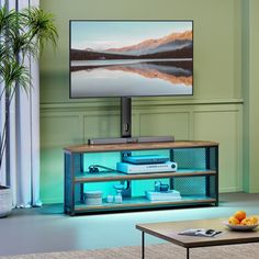 a flat screen tv sitting on top of a wooden stand