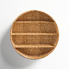 a round wicker shelf on the wall