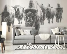 a living room with an animal mural on the wall