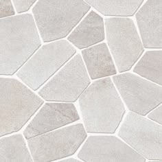 a close up view of a white and gray stone flooring pattern that looks like hexagonal tiles