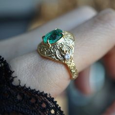 Introducing the "Emerald Scarab Ring" – a captivating blend of ancient Egyptian mystique and timeless elegance. Centered with a lush emerald framed by intricate Islamic patterns inspired by Egypt's architectural wonders, this ring evokes the opulence of ancient Egypt. Flanked by scarabs symbolizing rebirth, each holds a radiant diamond, echoing the sun's eternal sparkle on the Nile's waters. All orders come in our Tippy Taste ring box. This ring is handmade and designed in NYC. 14K or 18K solid gold Natural oval emerald, 8*6mm, approx. 1.20ct Natural round diamonds. SI clarity, GH color, 0.06ct total carat weight 3mm ring band ** Tippy Taste Heirloom Collection is made to order. Please allow 3-4 week turnaround time. Shipping:Domestic: Free shippingInternational: Free shippingAll orders ar Ancient Wedding Rings, Elegant 14k Stamped Emerald Ring, Luxury Emerald Birthstone Ring For Promise, Luxury Emerald Birthstone Promise Ring, Fine Jewelry Yellow Gold Emerald Ring With Intricate Design, Emerald Rings With Intricate Design For Anniversary, Exquisite Yellow Gold Emerald Ring, Oval Emerald Ring In Gold, Formal Emerald Ring With Intricate Design