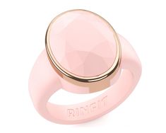 a pink ring with an inscription on the side and a rose quartz stone in the middle