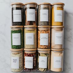 an assortment of spices and seasonings in glass containers