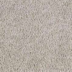 a close up view of the texture of a carpet with white and gray colors on it