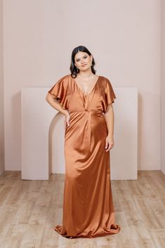 When you want a dress that offers more coverage but is still fresh and youthful, our graceful Gwen dress is the perfect solution. Gwen has delicate flutter sleeves and a V-neckline with built-in bra cups. The twist detail in the front makes this dress elegant and sophisticated. Wedding Parties Colors, Orange Bridesmaid Dresses, Modest Style, Angel Sleeves, Bridesmaid Dress Colors, Long Bridesmaid Dress, Satin Bridesmaid Dresses, Sparkle Dress, Frock Design