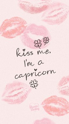 the words kiss me, i'm a capricon written in pink lipstick