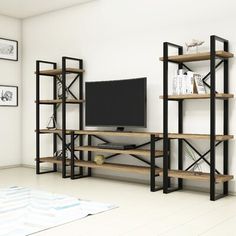 an entertainment center with bookshelves and a television