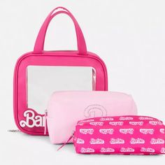 three pink bags sitting next to each other on top of a white surface with a mirror in the middle